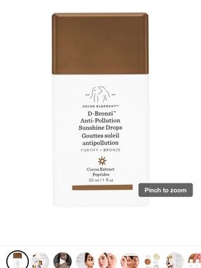 Drunk Elephant Glow-Boosting Sheer Fluid in Gold and White